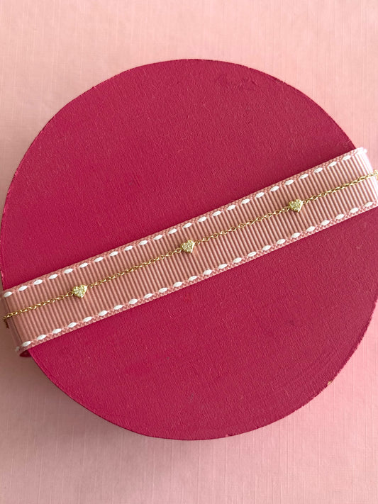 Pulsera corazones mini oro y cz