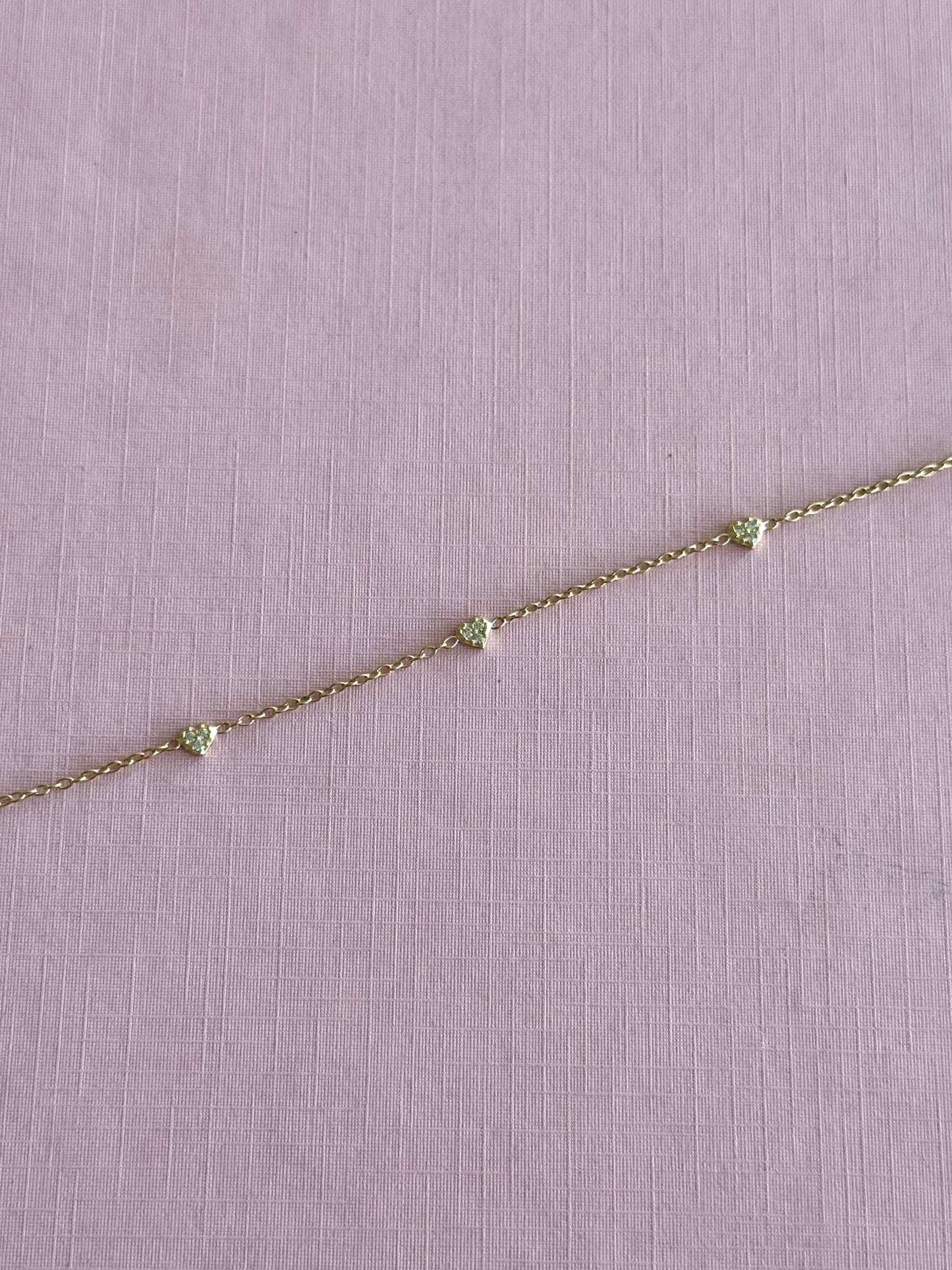 Pulsera corazones mini oro y cz