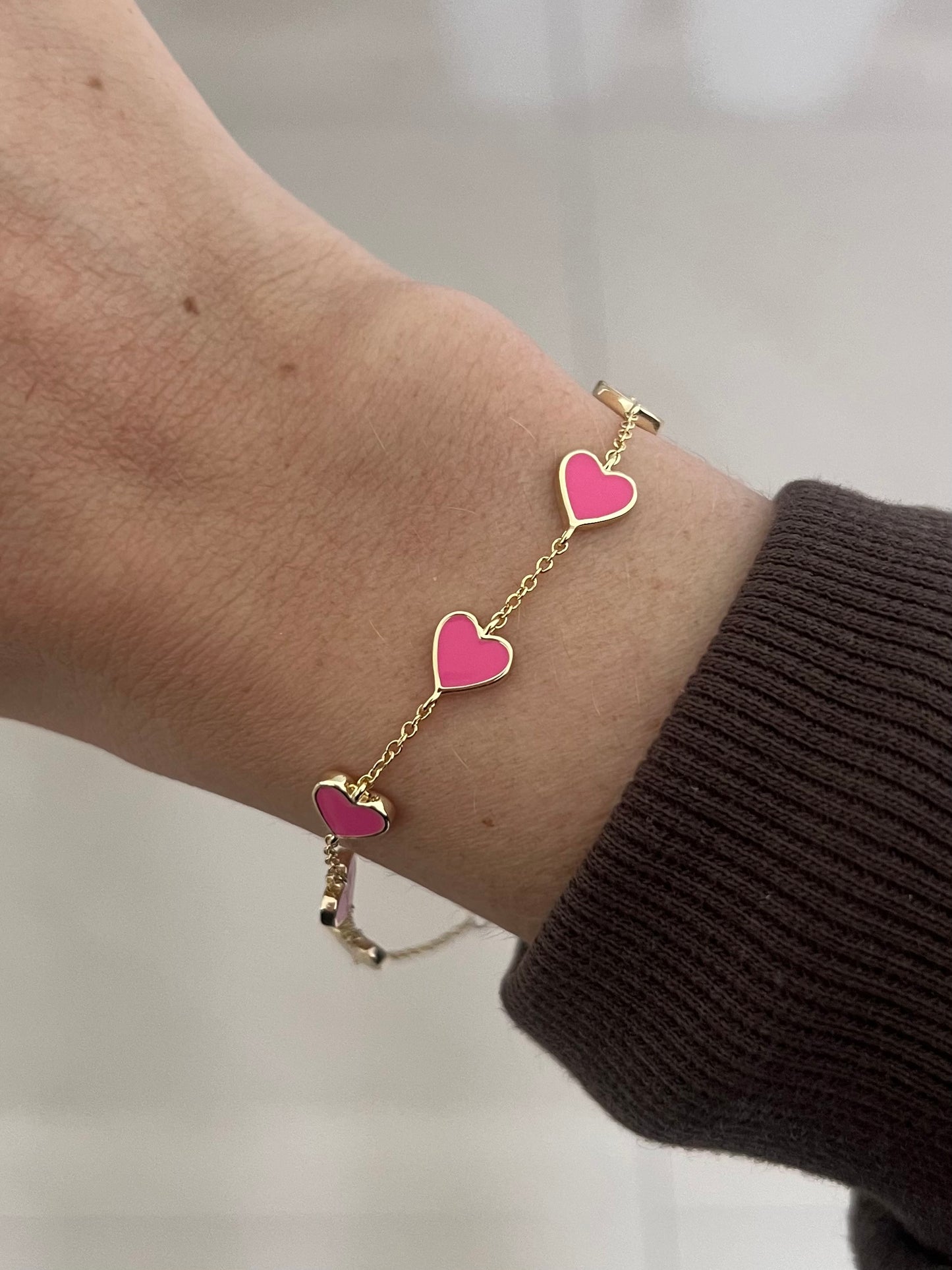 Pulsera corazones rosas baño de oro